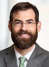Headshot of EIC Board Member Ryan Carney
